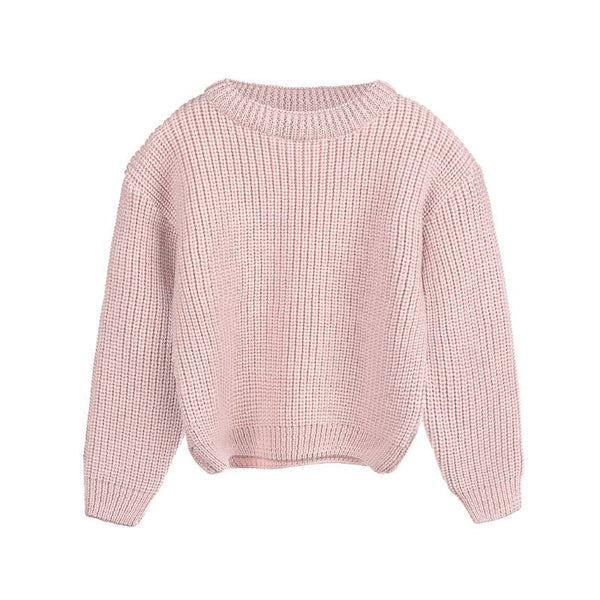 Sweter merino dla dziecka z luźnym krojem i długim rękawem.
Dziecięcy sweter z grubej dzianiny merino w kolorze pudrowy róż.